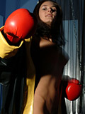 Horny girl Gianna with red boxing gloves plays with her big tits and a black strapon sex toy - 8