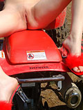 Not so beautiful but naked girl Meagan rides a red quad bike - 12